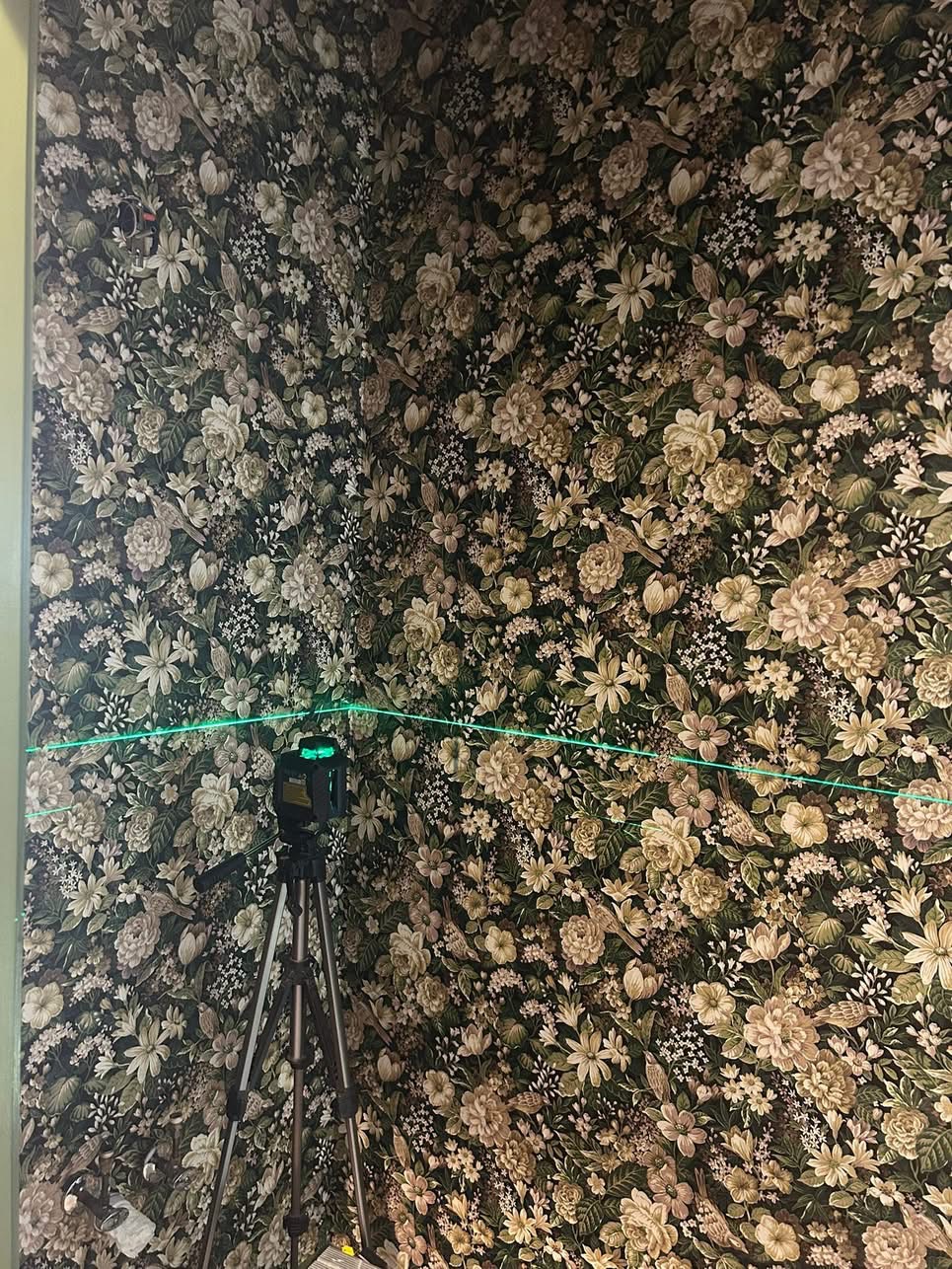 Victorian half bath with intricate floral wallpaper