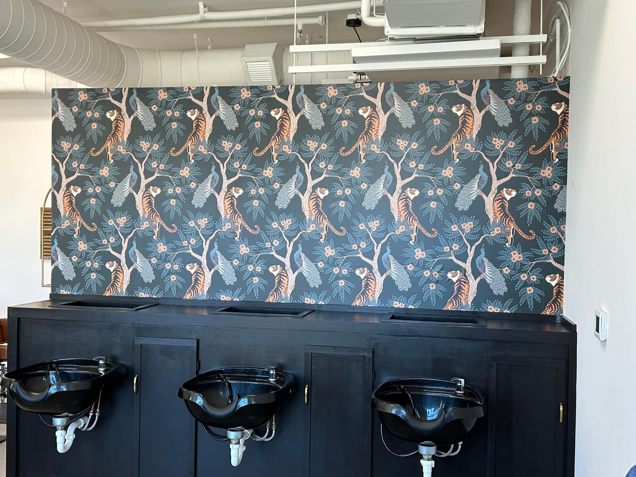 Commercial salon accent wall with tiger pattern wallpaper